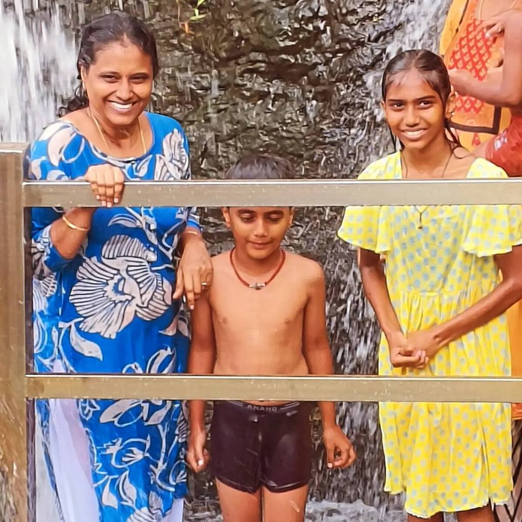 Yamuna with Aradhya and Advaith enjoying their first waterfall experience at Thirparappu Waterfalls